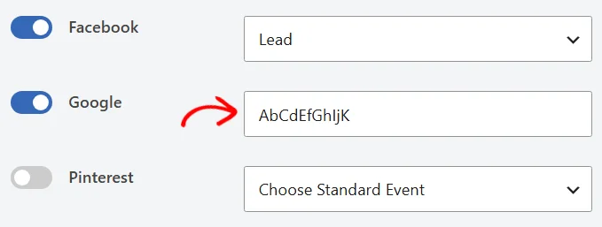 The Google toggle switched on with a conversion label entered in its field, a red arrow pointing at the field, and the Facebook row above still set to Lead
