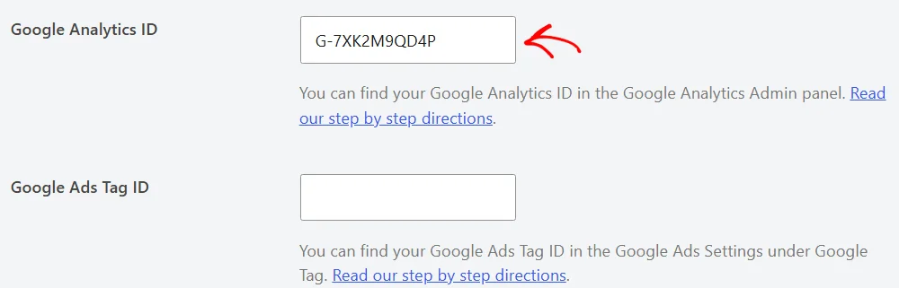 An arrow pointing at the Google Analytics ID field, filled in with an ID starting with G-