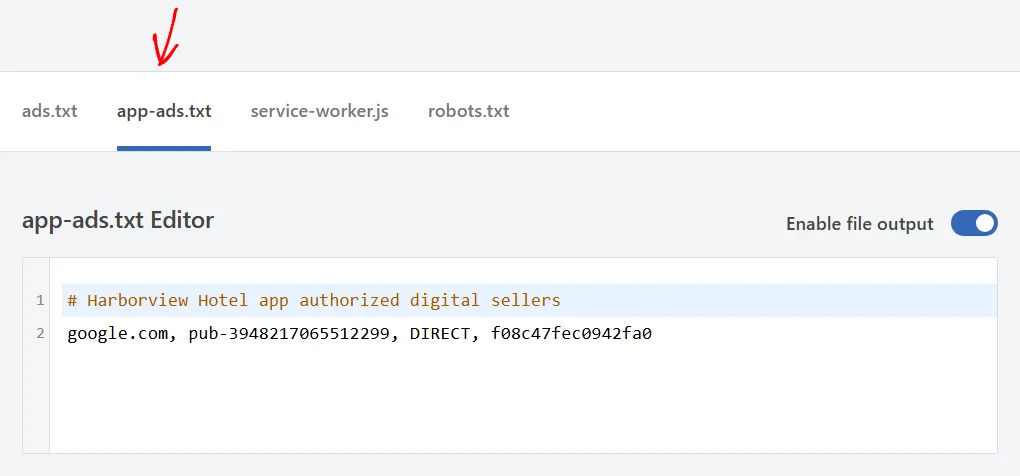 An arrow pointing at the app-ads.txt tab, with its editor below holding a comment line and a seller line