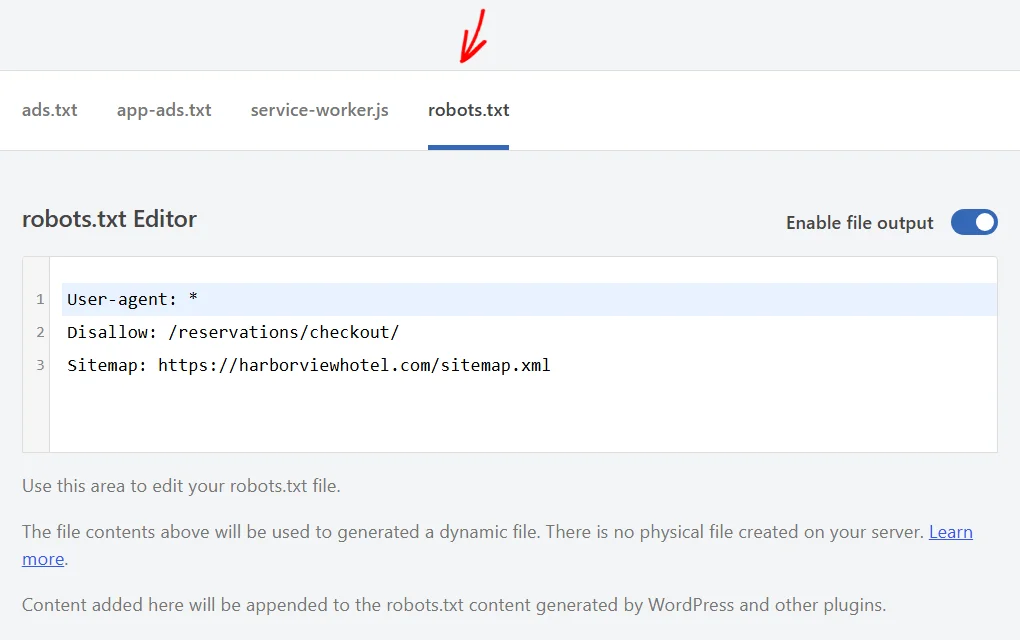 An arrow pointing at the robots.txt tab, with its editor below holding three directives and the note explaining that content is appended
