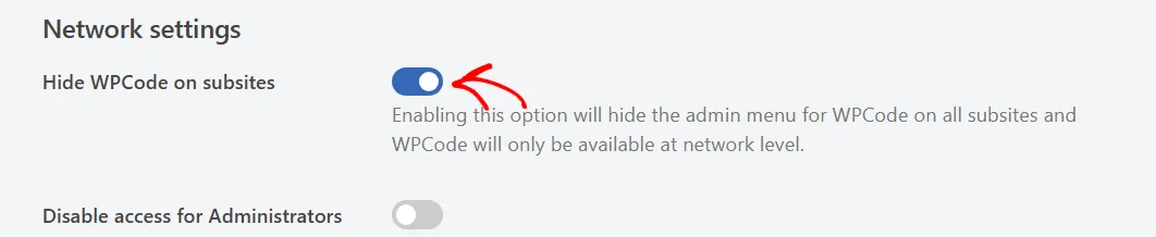 An arrow pointing at the Hide WPCode on subsites toggle under Network settings