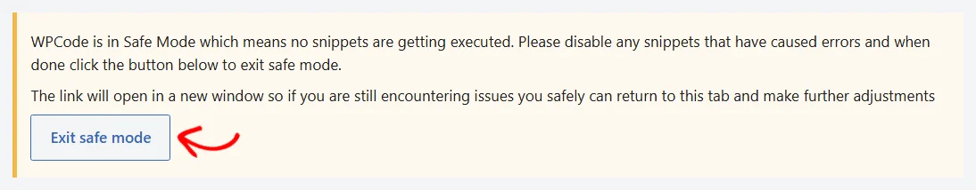 An arrow pointing at the Exit safe mode button in the WPCode safe mode notice